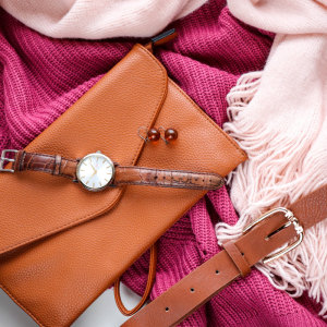 clothes and leather accessories laid out in a display